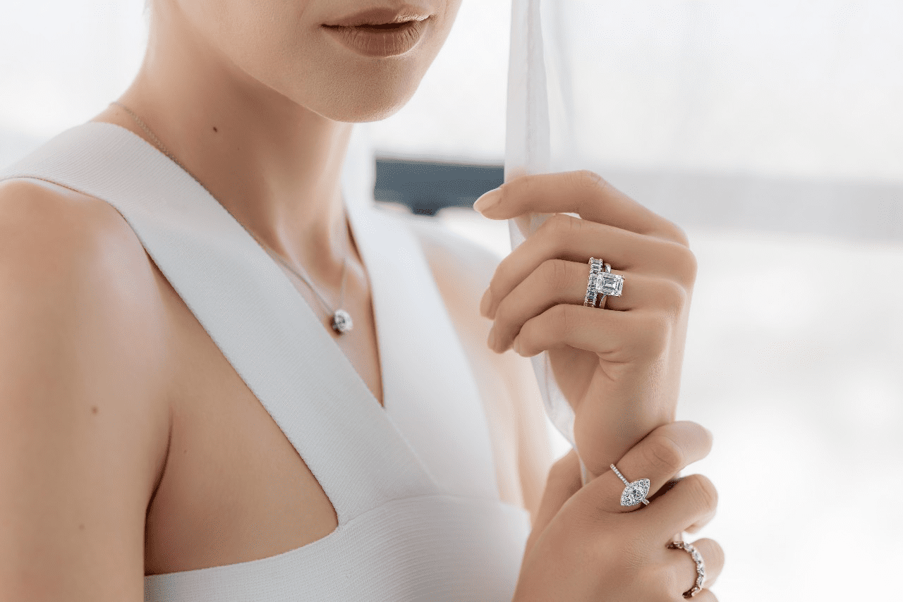 lady wearing engagement rings by TACORI.