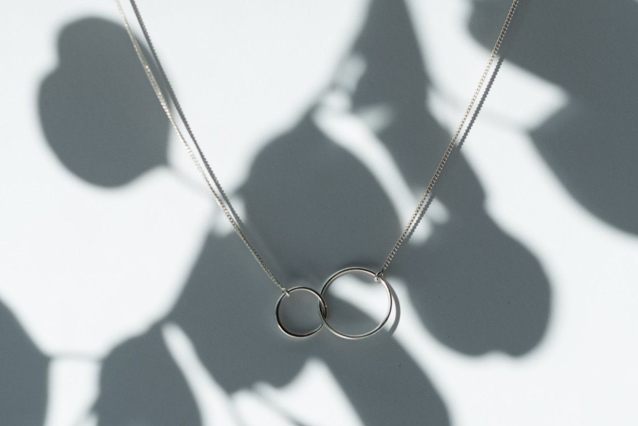 a platinum necklace featuring two interlocking rings