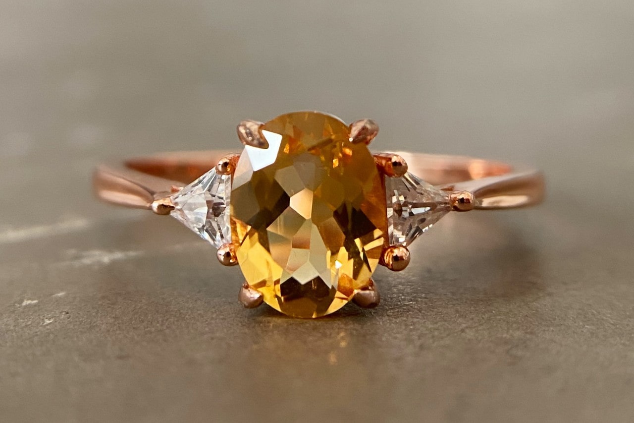 a rose gold fashion ring featuring a citrine center stone