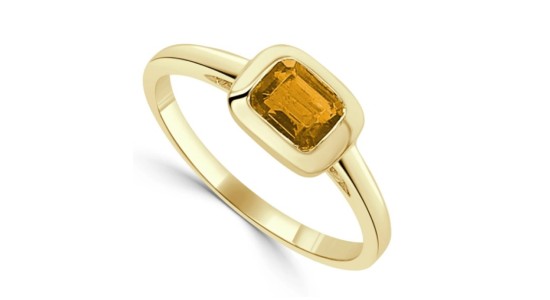 a yellow gold fashion ring featuring an emerald cut citrine