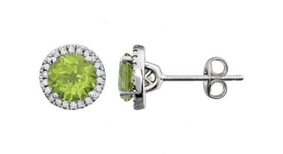 a silver pair of peridot halo stud earrings with diamond details