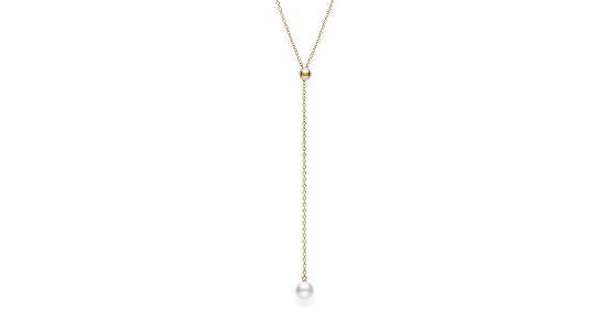 a yellow gold lariat necklace featuring a single pearl  and a gold sphere