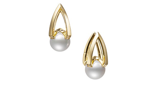 a yellow gold pair of earrings with pearls.