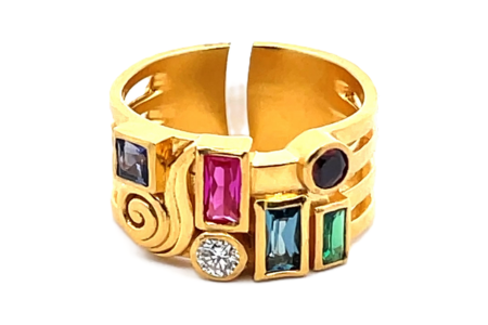 A yellow gold Gurhan fashion ring covered in colorful gemstones, available at Lewis Jewelers.