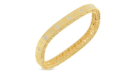 A yellow gold bangle bracelet from Roberto Coin, available at Lewis Jewelers.