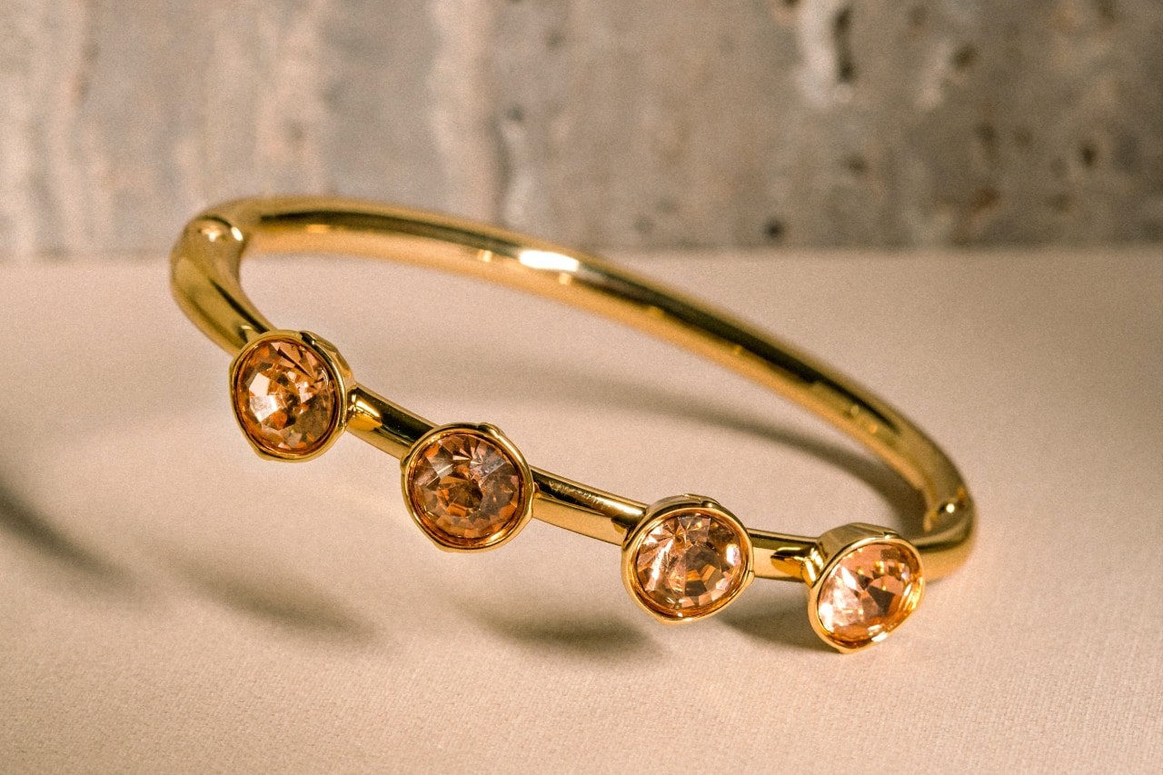 A yellow gold fashion ring with bezel set, round cut citrine gemstones.