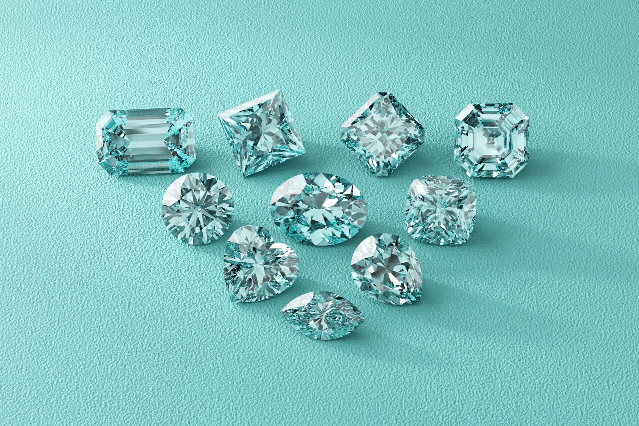 Ten diamonds in different shapes on a textured, turquoise blue surface.